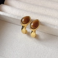 Golden C-shaped earrings featuring a teardrop-shaped brown gemstone in a jewelry box - C-Shape Gemstone / Gold