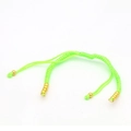Detail showing neon green braided cord bracelet with adjustable gold beads and closures - Apple Green