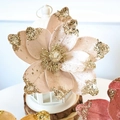 Close-up of velvet magnolia artificial flower with golden glitter petals and stamens - Begonia Champagne 22CM