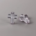 Macro shot of transparent lavender cross beads with faceted glass texture for DIY jewelry - Gray