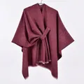 Detail view of burgundy knitted shawl featuring diagonal ribbing and frayed edge details - White Fringe with Stripe / Burgundy
