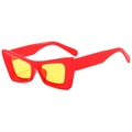 Retro cat eye sunglasses featuring a bold red frame and vibrant yellow lenses - Red