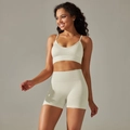 Detail of oatmeal ribbed knit yoga set showing V-neck sports bra and high-waist shorts - S / Top And Bottom / Cami Bra + Shorts / Cream