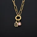 Gouden roestvrijstalen ketting met letter q en roze kristallen hanger - Letter A / Goud