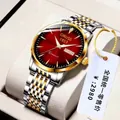 Macro detail of ORUSS business watch featuring red sunburst dial and gold calendar window - Premium Two-Tone Steel - Red Dial