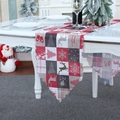 Plaid Christmas table runner with reindeer and snowflake patterns on white dining table - Plaid Style
