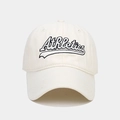 Detailed view of Athletics letter embroidery on a cream vintage cotton baseball cap - Beige
