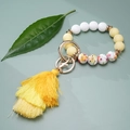 Yellow silicone beaded keychain bracelet with floral pattern bead and triple-layer tassel - Yellow Floral (#5)