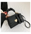 Quilted black handbag with golden heart lock and chic ruffled cloud-style handle - Black