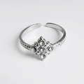 Silver adjustable ring with crystal flower cluster and embossed textured band details - Cross Steel