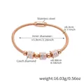 Detailed macro view of rose gold stainless steel bracelet with three diamond cylinder charms - Rose Gold Snake Bone Bracelet (Z004)