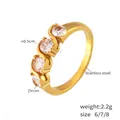 Minimalistischer 18k vergoldeter Edelstahlring mit vier runden Zirkonia-Steinen im Wellendesign - US 6 / Gold