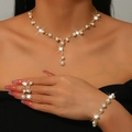 Detail view of pearl and diamond gold jewelry set including necklace, ring, and bracelet - Gold Artificial Pearl Necklace, Stud Earrings and Bracelet Set (483+747)
