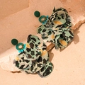 Macro shot of bohemian leopard print fabric petals and green beaded studs on stone - Green Mesh Leopard Petal (Silver Needle)