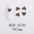 Detailed view of 7x7mm vintage gold heart nail charms with textured finish on a white tip - AF30-Bronze Style Stylized Heart
