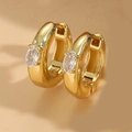 Golden huggie earrings featuring oval clear zircon in a minimalist four-prong setting - Oval White Zircon Gold