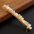 Detailed macro view of white natural stone crystals wrapped on a gold hairpin - White Moonstone + Gold Clip