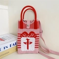Detail of pink knitted crossbody bag with red bow and Chinese character pattern - 2 Phone Bag-Pink 'Zhong' Character