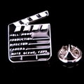 Detailed close-up of a movie clapperboard enamel pin with standard director terminology - Movie Clapperboard