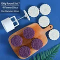 Macro detail of 100g round mooncake mold set with 65mm floral pattern stamps for baking - Round Set 7 (4 Patterns)