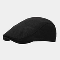 Detailed side view of black newsboy cap featuring textured knit fabric and sleek curve - M (56-58cm) / Black