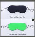 Detail of dual-sided sleep mask showing navy warm mesh and green cool silk textures - Navy Blue