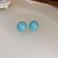 Close-up of sky blue resin round earrings on a white textured plate with soft lighting - Mint Green 925 Silver Pin Semi-Sphere Stud Earrings (2#)