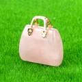 Mini rose quartz gemstone pendant in a handbag shape with gold metal handle details - Rose Quartz