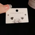 Three-piece silver earring set featuring black heart, star, and pearl saturn studs - Silver-Rhinestone Saturn Heart Set (55#)