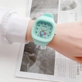 Close-up of mint green square silicone watch with a cute elephant dial on wrist - Elephant Sky Blue