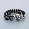 Close-up of wolf head magnet clasp on black braided leather and steel chain bracelet - Silver Wolf Head