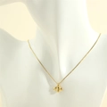 Detail view of 18K gold-plated bee pendant necklace shown on a mannequin bust - Gold