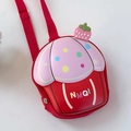 Detail of cute red and pink cupcake-shaped kids backpack with 3D strawberry and red strap - Red