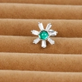 Macro shot of silver flower earring with green center gem and white zircon petals - Sunflower Style (E1357-6)