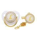 Close-up of golden luxury baby pacifier with crystal rhinestones and letter L detail - Letter L
