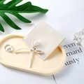 Creamy beige microfiber jewelry pouch with a matching ribbon bow and snap button - Microfiber Ribbon Style / 7*7cm / Off White