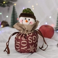 Close-up of a festive Christmas snowman drawstring gift bag with JOY print and cozy textures - English Print Snowman