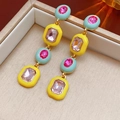 Macro shot of luxury vintage gold drop earrings with colorful square crystals in a jewelry box - Silver Pin Gold Colorful (Earrings)