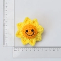 Handmade crochet sunflower pendant with yellow petals and a smiling face measuring 6 cm - Pointed Smiley Sunflower