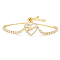Macro shot of gold-tone MAMA heart bracelet with cubic zirconia and adjustable slide - Heart MAMA