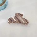 Close-up of large brown and beige striped acetate hair claw clip with metal spring - 10.5cm / Khaki Coffee Silver Stripe