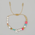 Handmade beaded bracelet featuring a white letter R pendant and baroque pearls for women - Letter R Style (ZZ-B24061901R-F)