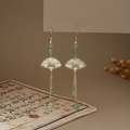 Detail of Chinese style butterfly fan earrings with green beads and long metal tassels - E6413 (Gold/Hollow Fan/Long Tassel/Green Bead)