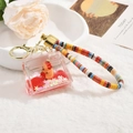 Capybara acrylic liquid sand keychain with red fluid and a cute orange animal charm - Capybara Quicksand (Lanyard Style) / Mini Bag