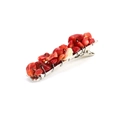 Detail view of red natural crystal chips secured on a silver alligator hair clip base - Red Coral