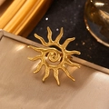 Detailed close-up of a golden sun-shaped ring with textured sunburst and wave patterns - 02 18k Real Gold 0288