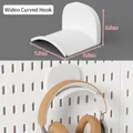 White curved pegboard hook for headphone storage with dimensions 7.5x6.8x5.5cm - Curved Headphone Hook - White