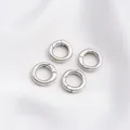 Set of four polished silver spring ring clasps for DIY jewelry making on white satin - Platinum Color Round Spring Clasp 13x3mm