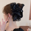 Elegant large black mesh bow hair clip with pearls and sequins worn by model - Claw Clip-Black Sequin Bow