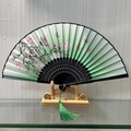 Classic Chinese folding fan with green gradient sakura design and elegant tassel - Graceful and Tall